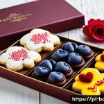 기념일 선물 제과 - **"Artisanal Portuguese Sweet Gift Box: A close-up, top-down shot of an exquisitely arranged gift bo...